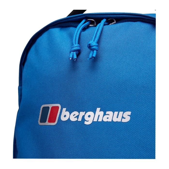 A bright blue backpack featuring the logo 'berghaus' prominently displayed in white text with red and blue accents is depicted with drawstrings visible on top against a plain background.