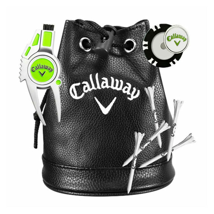 A black leather pouch with a drawstring contains golf accessories including a green and silver divot repair tool a golf tee marker and several white golf tees decorated with a logo.