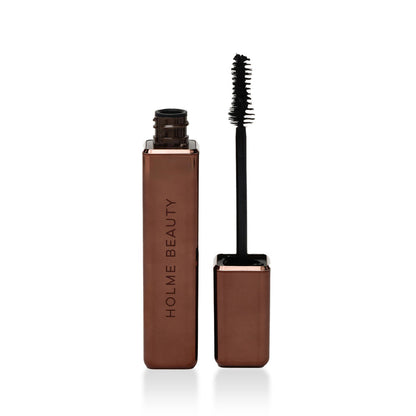 Brown mascara with black wand on a white background, branded 'Holme Beauty'.