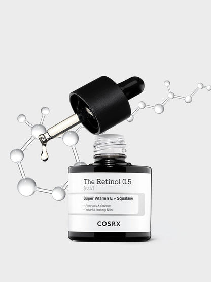Hero shot of COSRX The Retinol 0.5 Oil with molecular graphics; 0.5% pure stabilized retinol blended with Super Vitamin E + squalane for firmness, smoothness, and youthful glow; ideal for advanced retinol users seeking anti-aging and acne-compatible retinol care.