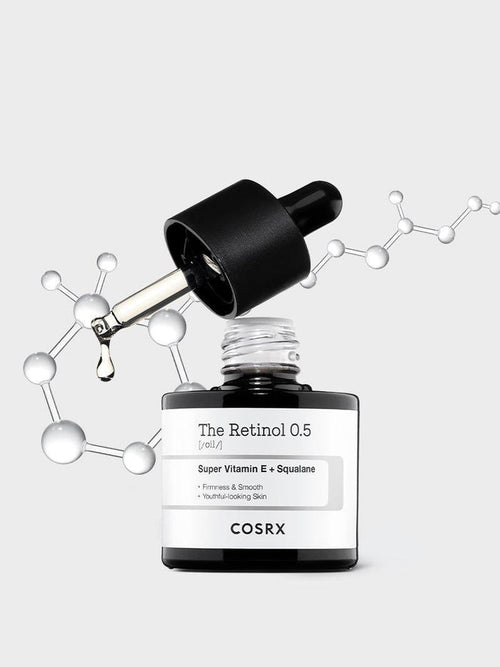 Hero shot of COSRX The Retinol 0.5 Oil with molecular graphics; 0.5% pure stabilized retinol blended with Super Vitamin E + squalane for firmness, smoothness, and youthful glow; ideal for advanced retinol users seeking anti-aging and acne-compatible retinol care.